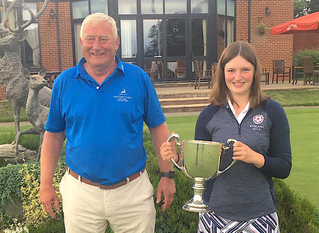 Lottie Woad is presented with the Centenary Scratch Cup by Porters Park captain George Copley