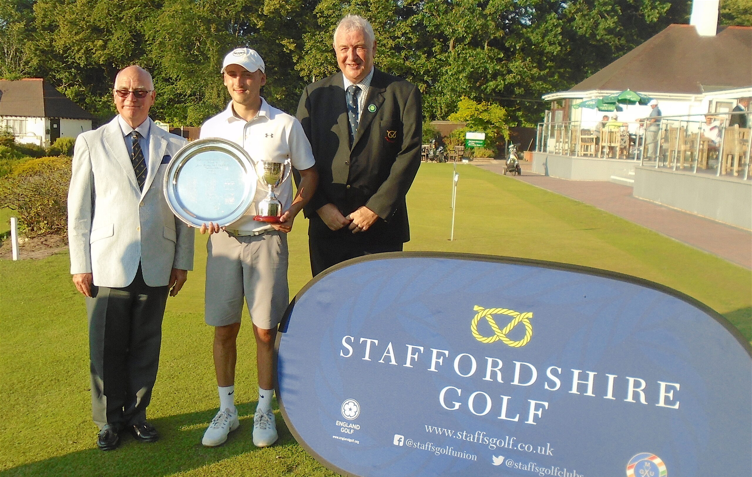 Ollie Read is presented with the County Championship trophy and the Youths prize (U-22s) by Frank Wilson (South Staffs GC President) and Michael Entecott (SUGC President)