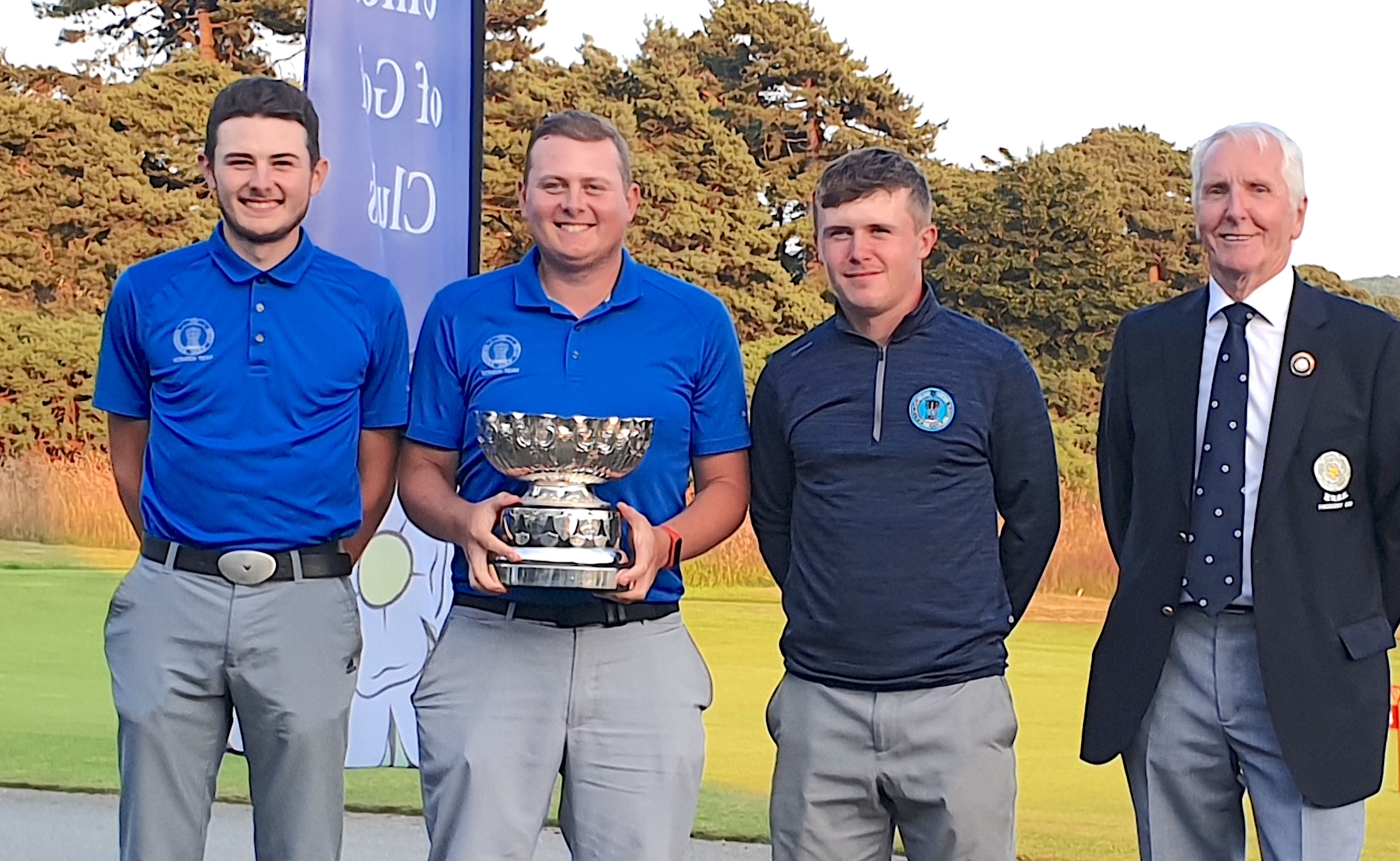 CHAMPIONS AGAIN: Nick Raybould holds the trophy, presented by Yorkshire president Cameron Thomson. Far left is Matt Raybould and also pictured is Jack Maxey