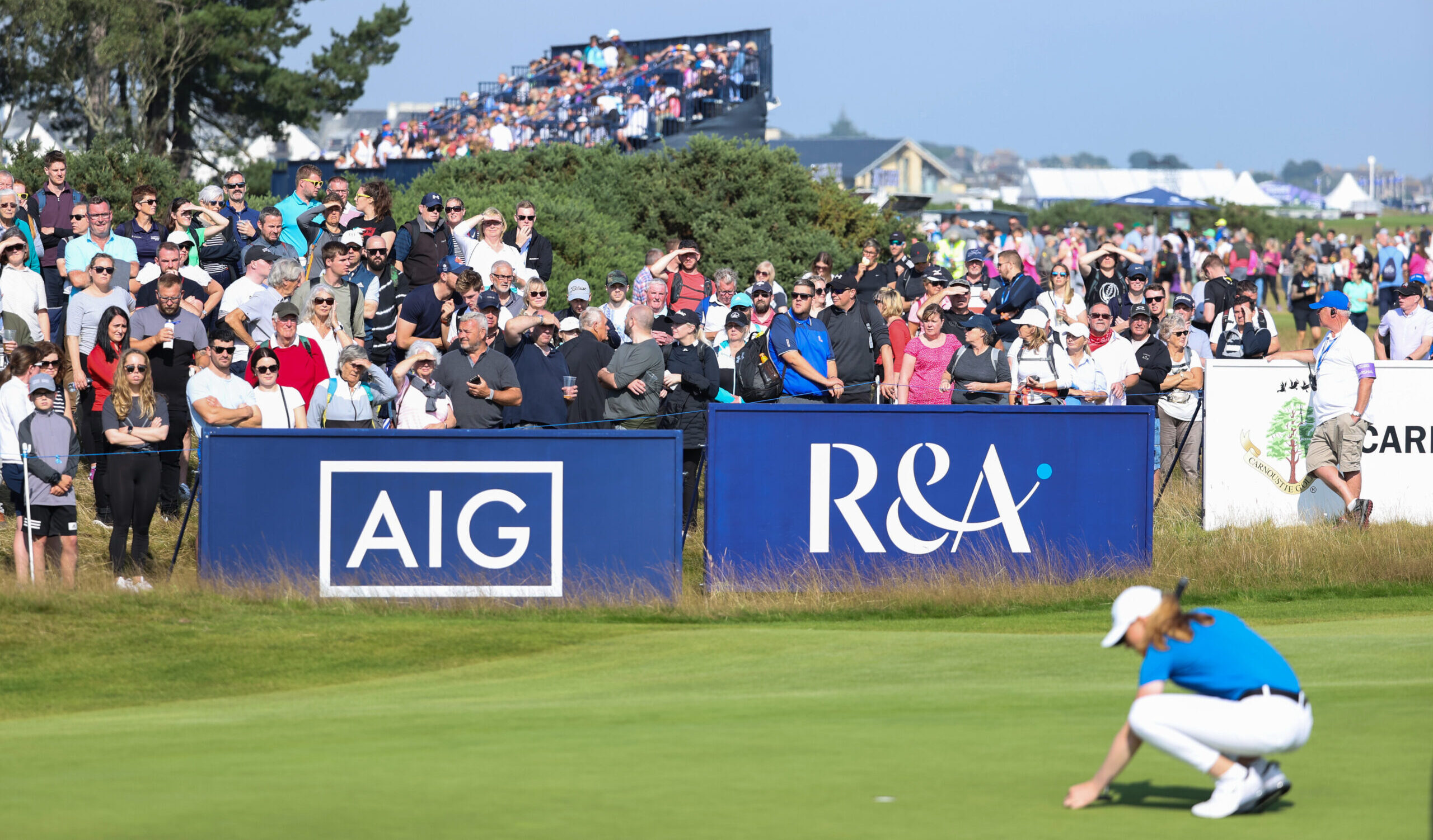 Crowds watch on as Louise Duncan of Scotland lines up a putt on the seventh green during Day Four of the AIG Women's Open at Carnoustie Golf Links. (Photo by Warren Little/R&A/R&A via Getty Images)