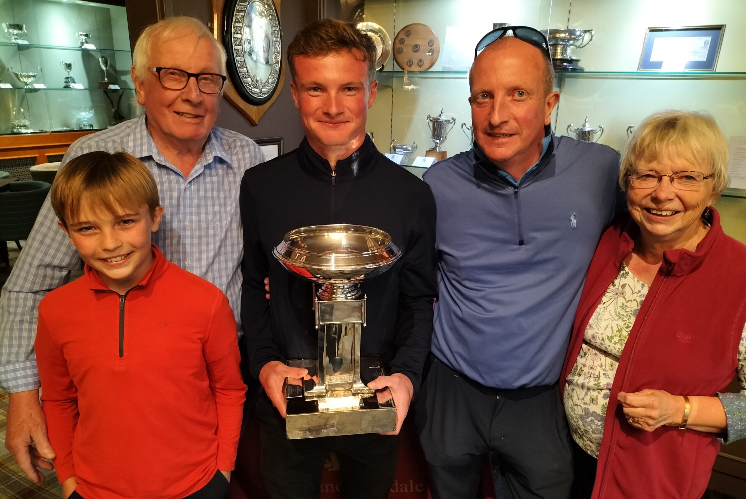 S&A Bowl champion James Holland surrounded by grandparents Norman and Margaret Holland, dad John and little brother Jude