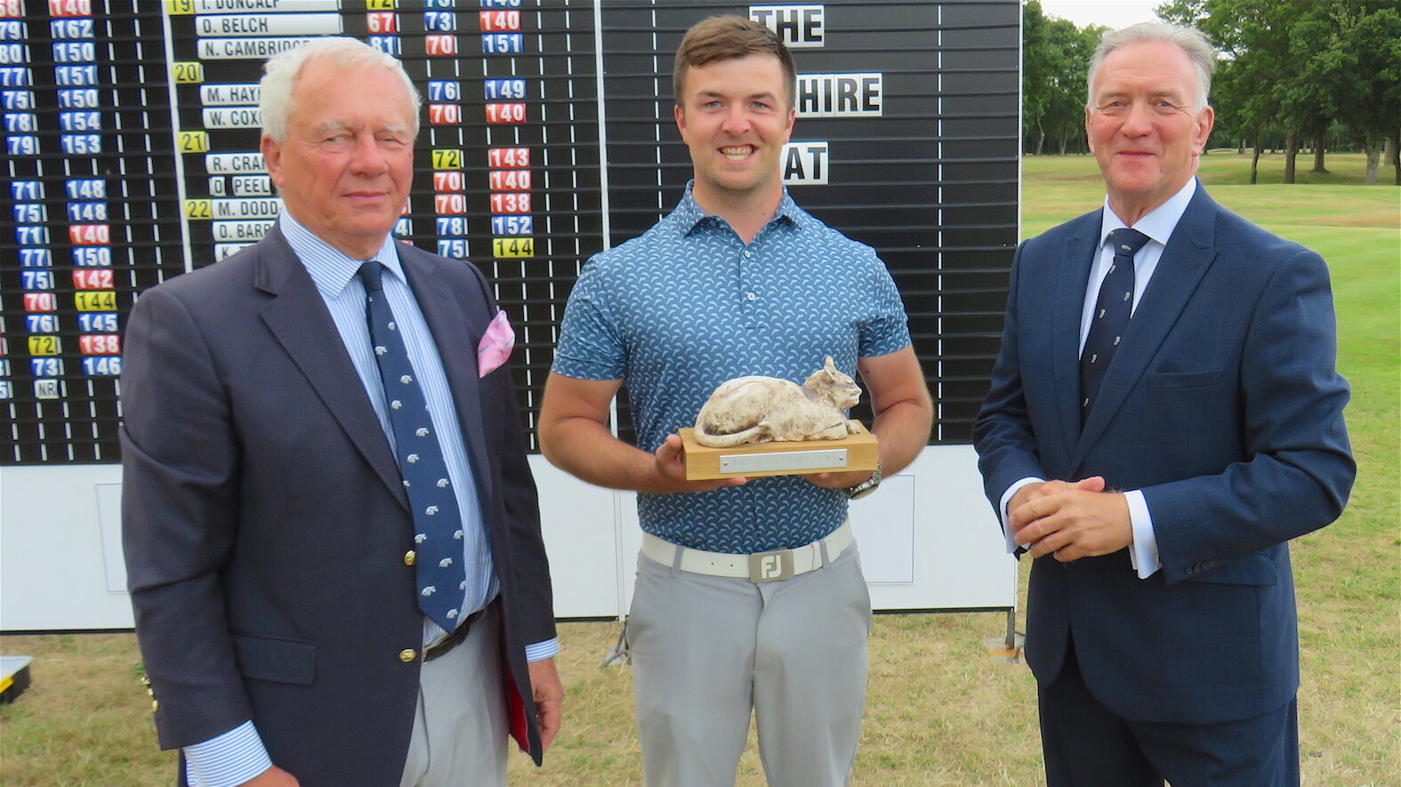 Cambridgeshire's Ed Dimambro with Wilmslow captain Berkeley Thirsk (left) and Stockport Salver committee head Tom Clarke
