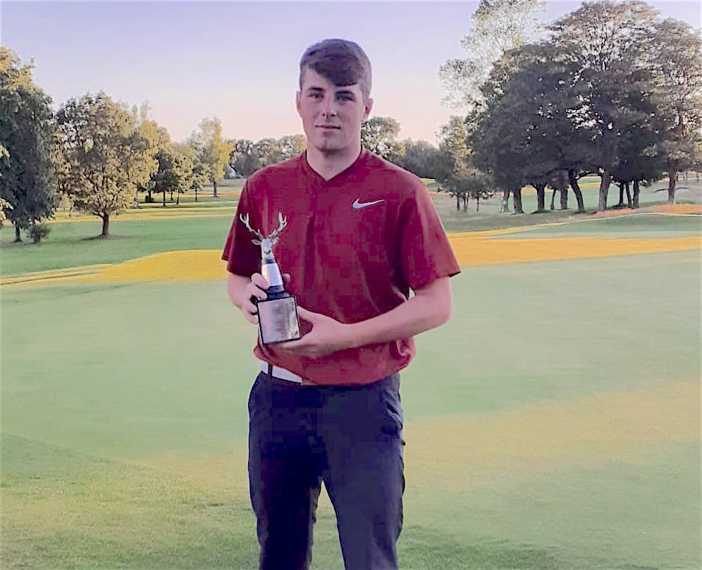 Southport & Ainsdale's Jack McPhail with the Pleasington Antlers trophy