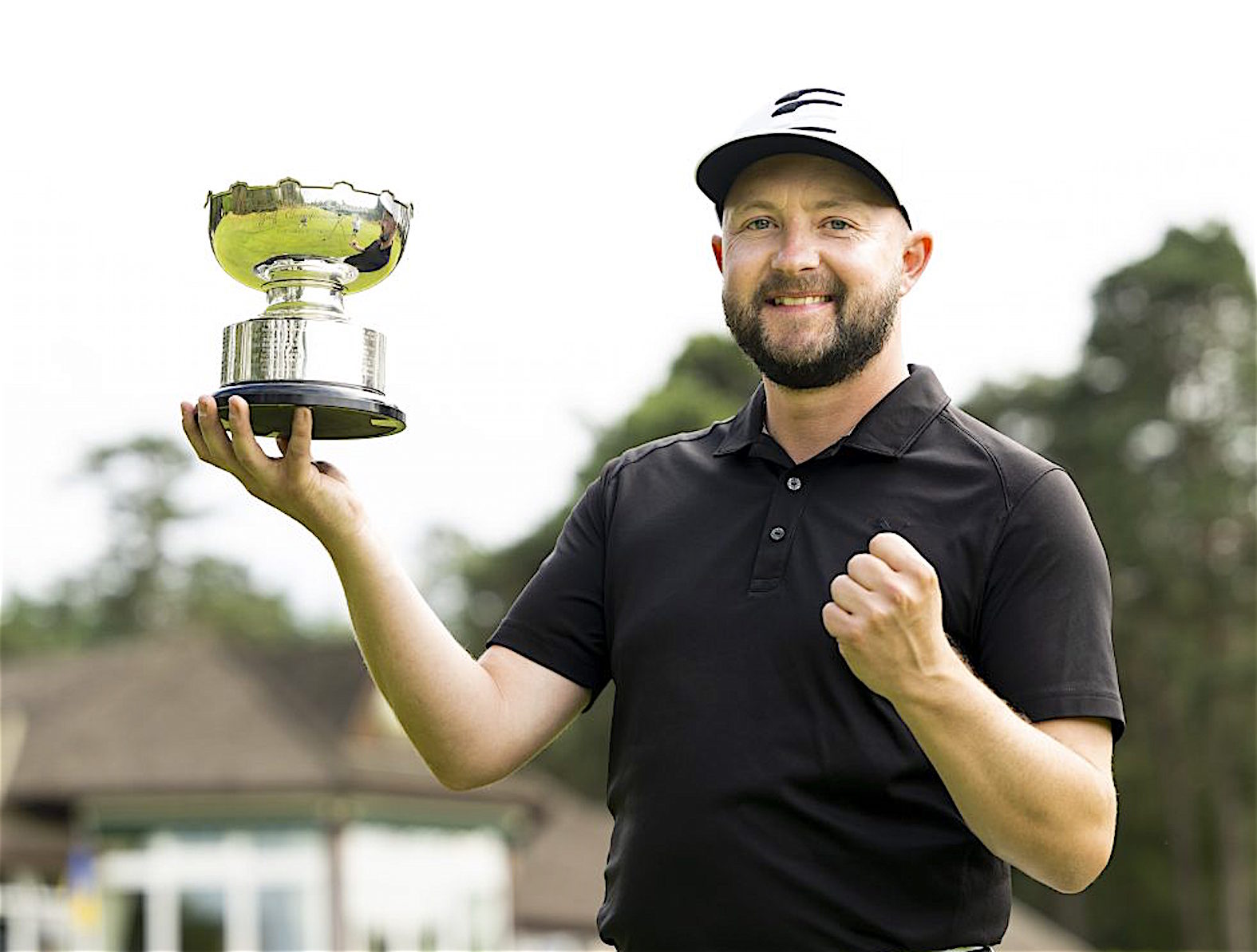 Stuart Archibald celebrates winning the Logan Trophy (England O-35s) at Liphook Golf Club