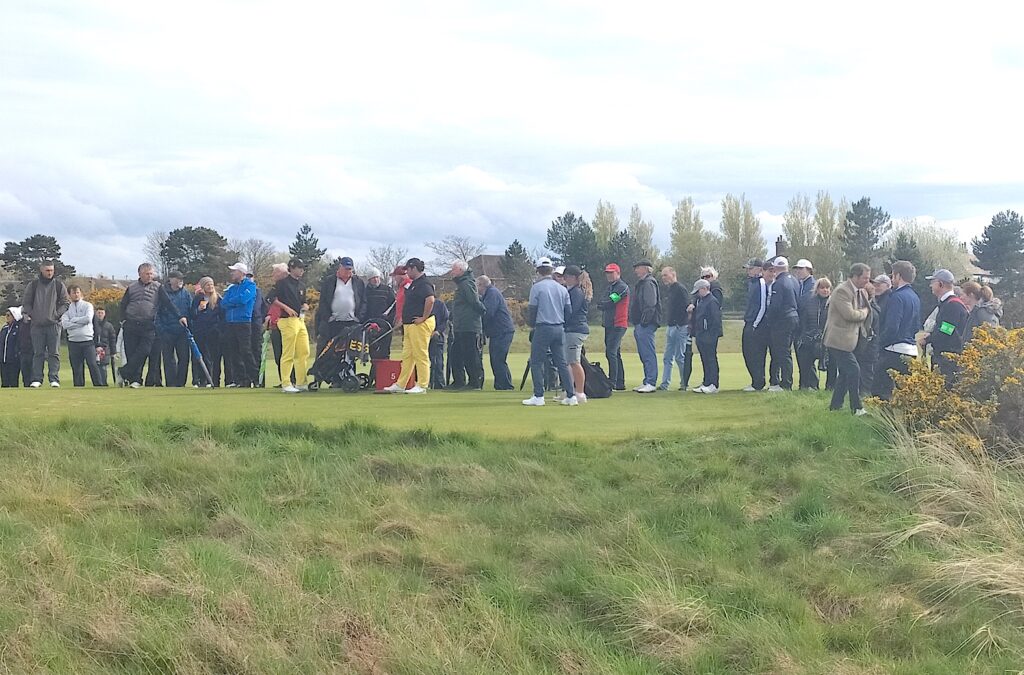 The final group wait to tee off the fifth. Moments later Luis Masaveu holed in one at the par three