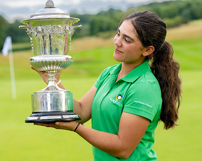 Gia Raad lifts the English Girls' Open Stroke Play Championship trophy at The Caversham Golf Club