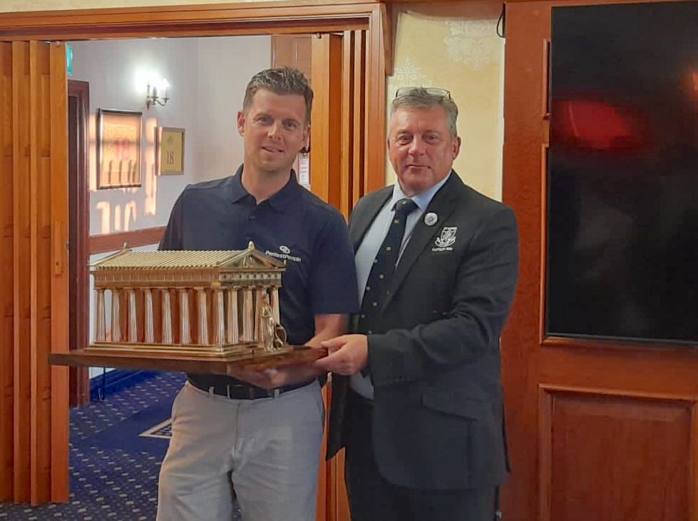 Danny Belch is presented with the Ashton Trophy at St Annes Old Links